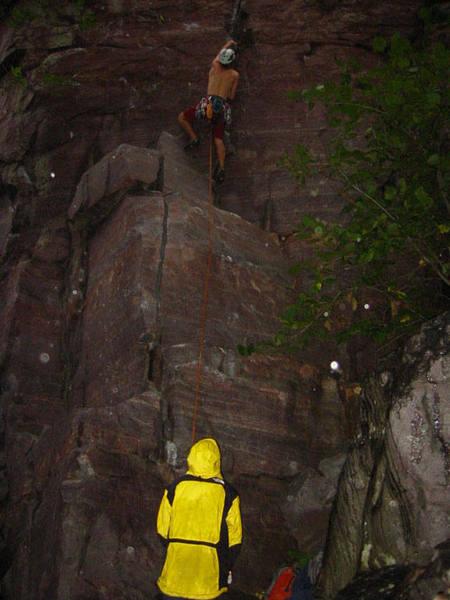 Dan F starting the lead of Sometimes crack 5.10a in the middle of the rain. Photo Mike Lopera