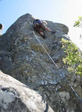Brian pulls his way up the crack just before the crux. Copyright 2002 Melissa Moore