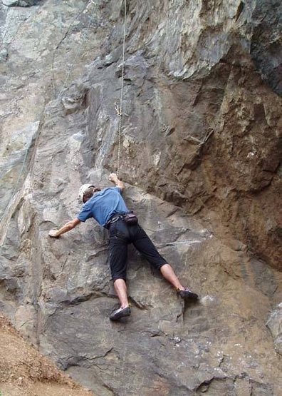 The slick and treacherous first moves. Looks silly so close to the ground. These can be bypassed by climbing straight up further left.