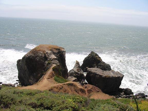 From the approach, about halfway down the trail. The Main Rock is on the left, Peeper's Rock is the front right, and The Grey Slab is the back right rock.
