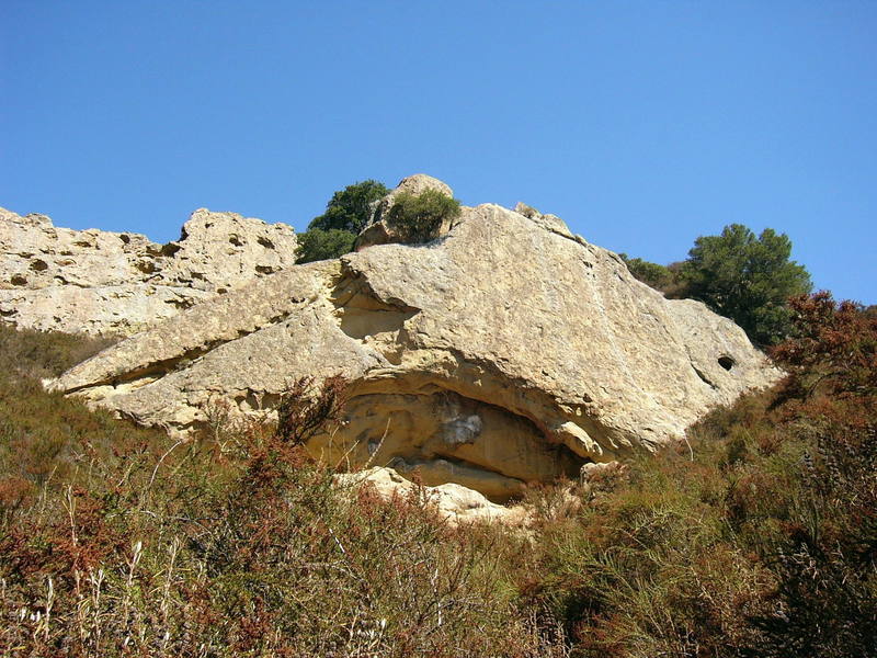 Photo taken from the path leading directly down from Flintstone Rock on a beautiful, sunny day. Route shown is the only bolted route on the Flintstone Rock, Yabba Dabba Dudes (10a). Sept 25, 2005.