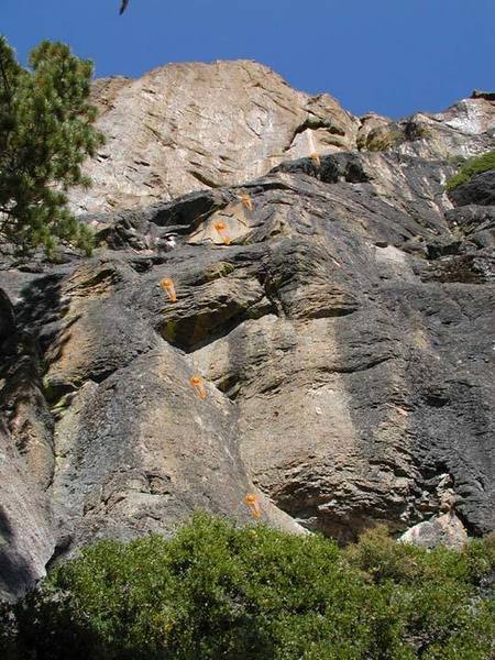 The 3 vertical sections and first 6 bolts of toilet earth. Climbing after the picture is a 5.1 slab that heads up and left towards the copper flake. The last move is about 5.6.