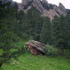 A boulder in a green meadow below Dinosaur Mtn with permission from BoulderTraveler