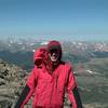 A lowlander friend summits his first 14er, with some amazing views of the Front Range behind him.