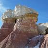 Sandstone capped spires with clay containing oxidized iron- Paint Mines Park
