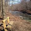 A small bench overlooking the Euclid Creek.