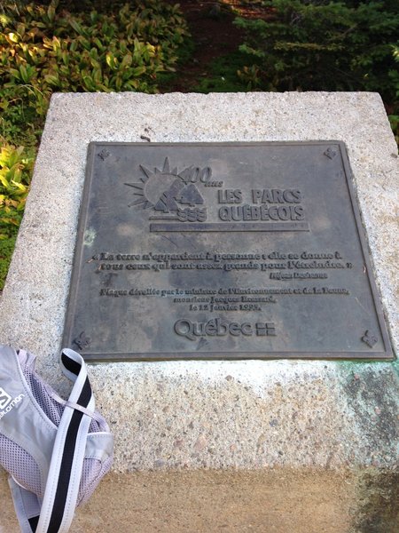 Marker at the summit of Johannsen Peak.  "The land belongs to anyone: she gives herself to all those who are big enough for the hug. "-Réjean Ducharme