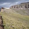 The trail up Uncompahgre Peak. The summit is visible to the right; your goal is to hike to the left of this massif before traversing behind it to the top.