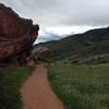 An amazing rock face and southern hills on the Trading Post Loop Side Trail at Red Rocks Park and Amphitheater.