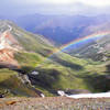 Near the summit of Handies Peak, 14,048 ft., the high point of the race course. A passing storm created a rainbow over Grizzly Gulch. July 2009.