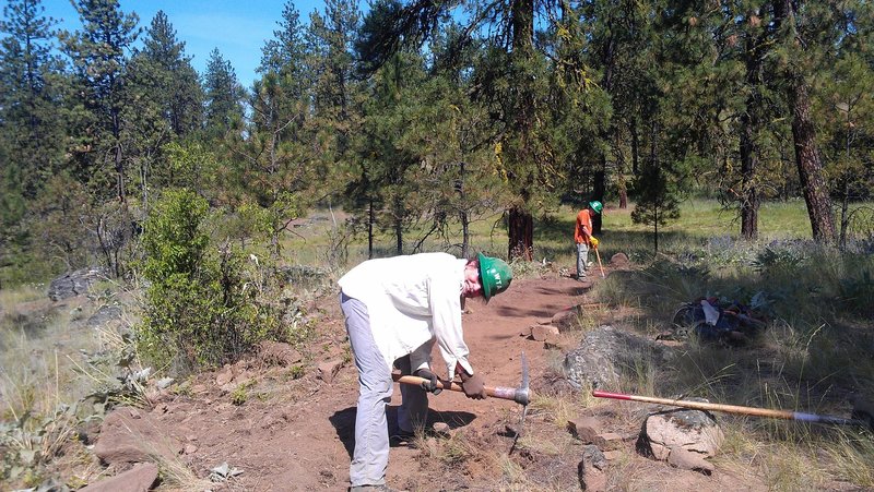 Volunteers working on the tread for the new section of trail in 2014.