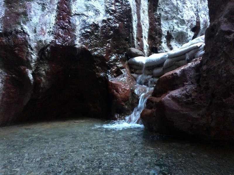 Small warm waterfall from upper pool.