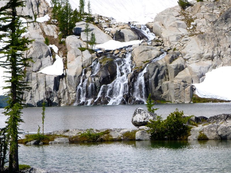 Waterfalls alongside the lake.