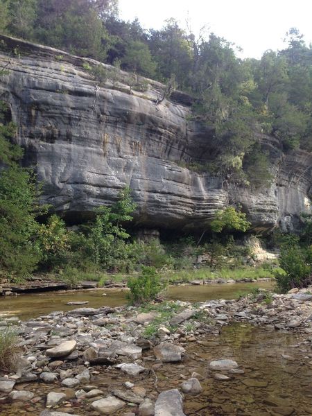 Sandstone bluffs rise from Sylamore Creek.