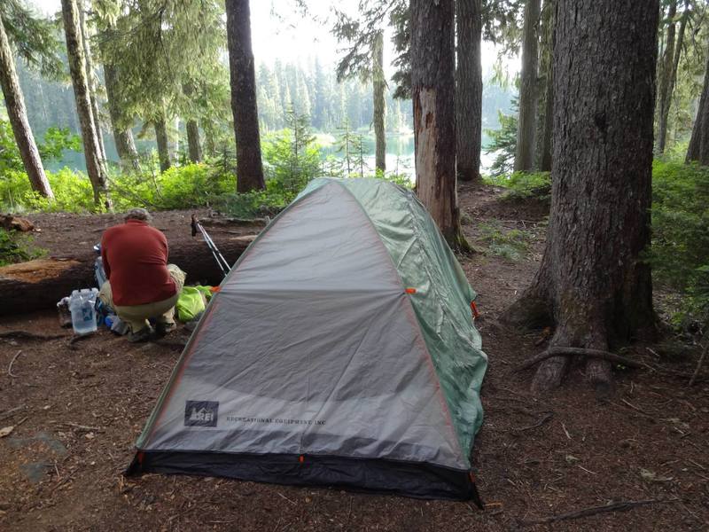 Setting up camp at lower Flapjacks Lake while hiking the Gladys Divide Trail.