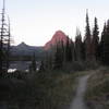 Starting the Loop Hike (going clockwise) before sunrise. Sinopah Mountain yielded an incredible alpenglow in the first mile on the trail along Two Medicine Lake.
