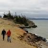 Hikers bundle up as they leave Storm Point on a stormy September afternoon.