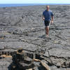 Following the ahu (cairns) across the pahoehoe lava. (NPS photo by Jay Robinson).
