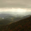 Sunlight filtering through clouds over Asheville, as seen from the Mountains-to-Sea Trail. Photo by Matt Mutel.
