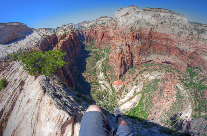 Legs dangling over the Angels Landing precipice.