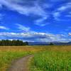 Rain can be seen in the distance from the Mary Mountain-Nez Perce Trail.