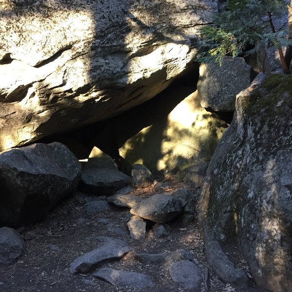 One the the entrances/exits to the Spider Cave. Passing through the cave requires crawling/sliding.  Headlamp strongly recommended! There are bear boxes just near the entrance where you should store any backpacks prior to entering.