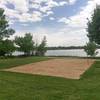 The sand volleyball court next to McIntosh Lake.
