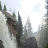 Ouzel Falls, raging, misting visitors as they look at it's majestic wonder.