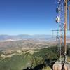 View from summit toward Utah Valley. Utah Lake is visible behind the cell tower.