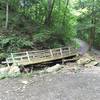 Bridge that has been washed out due to storm.
