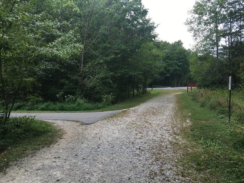 Unpaved section ends. Take a left onto paved trail.