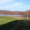 Grass field at the top of the dam along North Country Trail. Great view of Lake Arthur.
