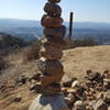 A tall cairn marks the trail.