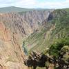The Gunnison River far below winds away from the Pulpit Rock Overlook.