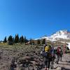 A group of hikers heads to Mt. Hood on the Mountaineer Loop Trail.