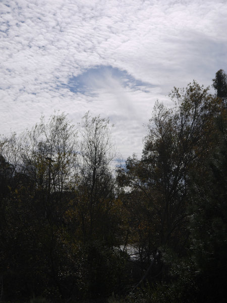 A "hole punch" cloud floats over Shaw Valley.