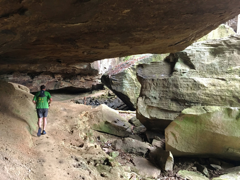 Ducking under some great rock formations is all part of the experience along the Lick Creek Trail.