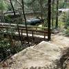 Start the trail by crossing a sturdy wooden bridge over the gurgling Looking Glass Creek.