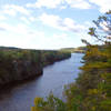 The mighty St. Croix River flows through the towering cliffs lining its banks.