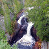 The mysterious Devil's Kettle drops through forest and bedrock to the water below.