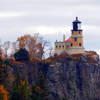 Split Rock Lighthouse stands perched atop the cliff.