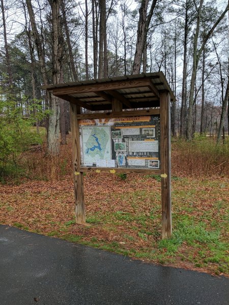 Maps showing the "yellow trail arrows" are located at the major trailheads.