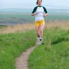 A runner finishes up a lap on the Whitetail Trail at Bennington Lake.