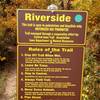 A sign marks the beginning of Riverside.