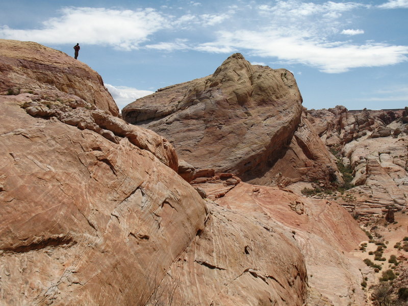 Valley of Fire rocks dwarf a hiker.