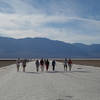 Hikers return from Badwater Basin along this hard baked alkali plain.
