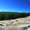 The summit of Stone Mountain offers beautiful views of Wolf Rock in the background.