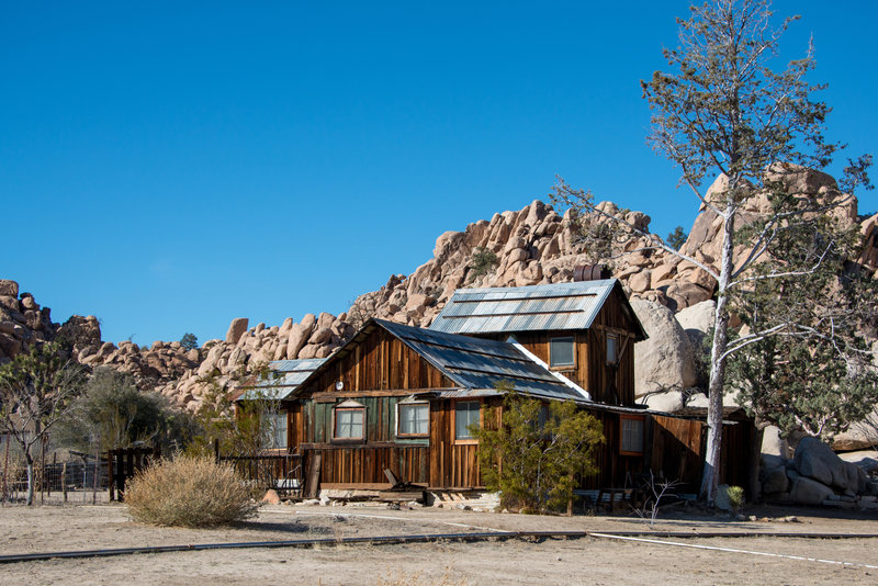 The Ranch House is nestled against a rock outcropping at Keys Ranch. Photo credit: NPS/Lian Law.