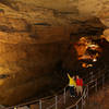 Visitors enjoy the narrow passage of Thanksgiving Hall in Mammoth Cave. Photo credit: NPS Photo.