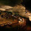 Visitors learn about Mammoth Cave from a ranger in the Broadway section of the cave.